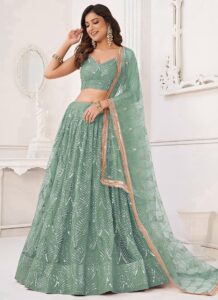 Turquoise net umbrella lehenga choli with heavy hand embroidery