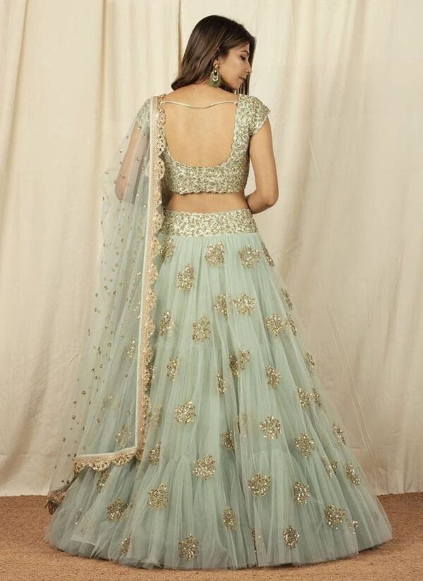 Mint green net lehenga with sequins embroidery wedding wear back view