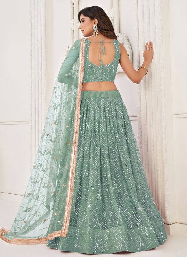 Turquoise net umbrella lehenga choli with heavy hand embroidery back view