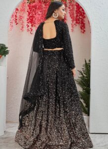 Black velvet umbrella lehenga choli with shimmery sequins and net dupatta back view