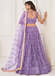 Lavender net umbrella lehenga choli with handwork and sequins back view