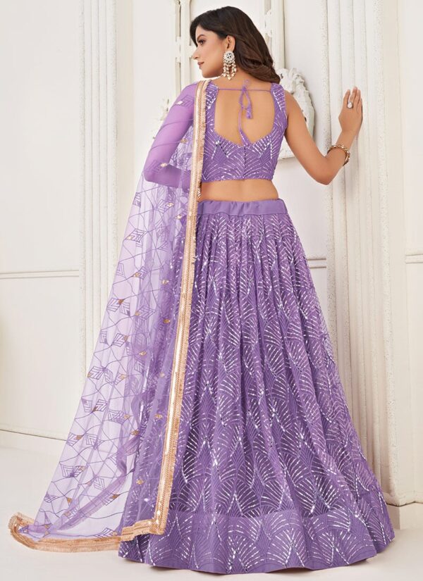 Lavender net umbrella lehenga choli with handwork and sequins back view