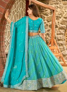 Sky blue umbrella lehenga choli with embroidered border festive wear back view