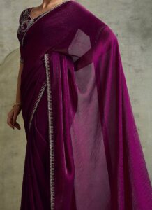 Wine faux chiffon saree with stone-embellished border side view