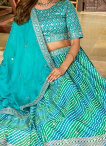 Sky blue umbrella lehenga choli with embroidered border festive wear side view